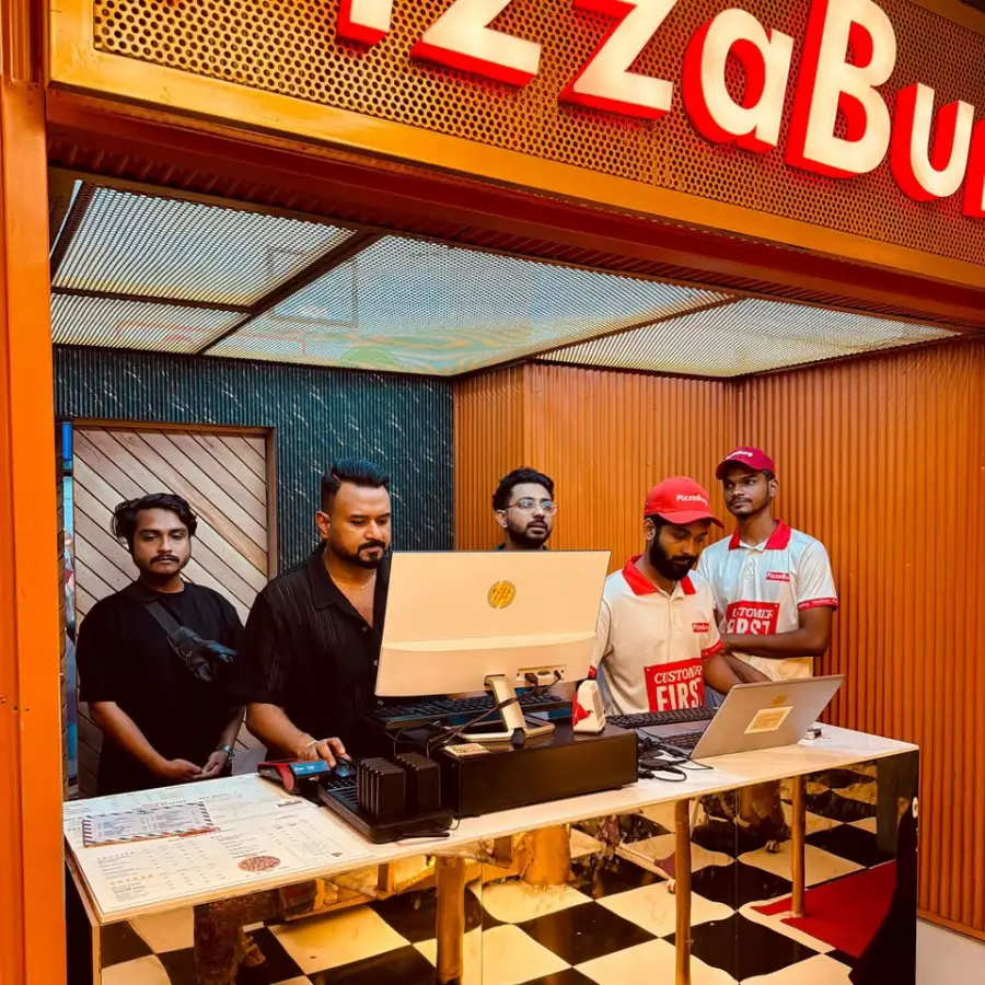 PizzaBurg team at the front desk
